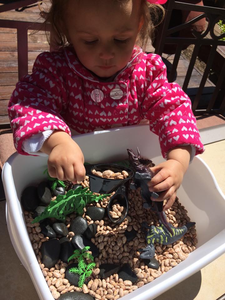 G enjoying her sensory bin