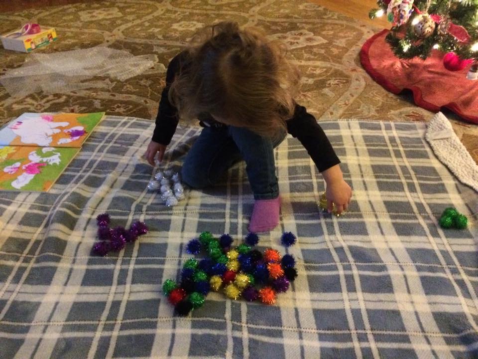 G sorting the pom poms